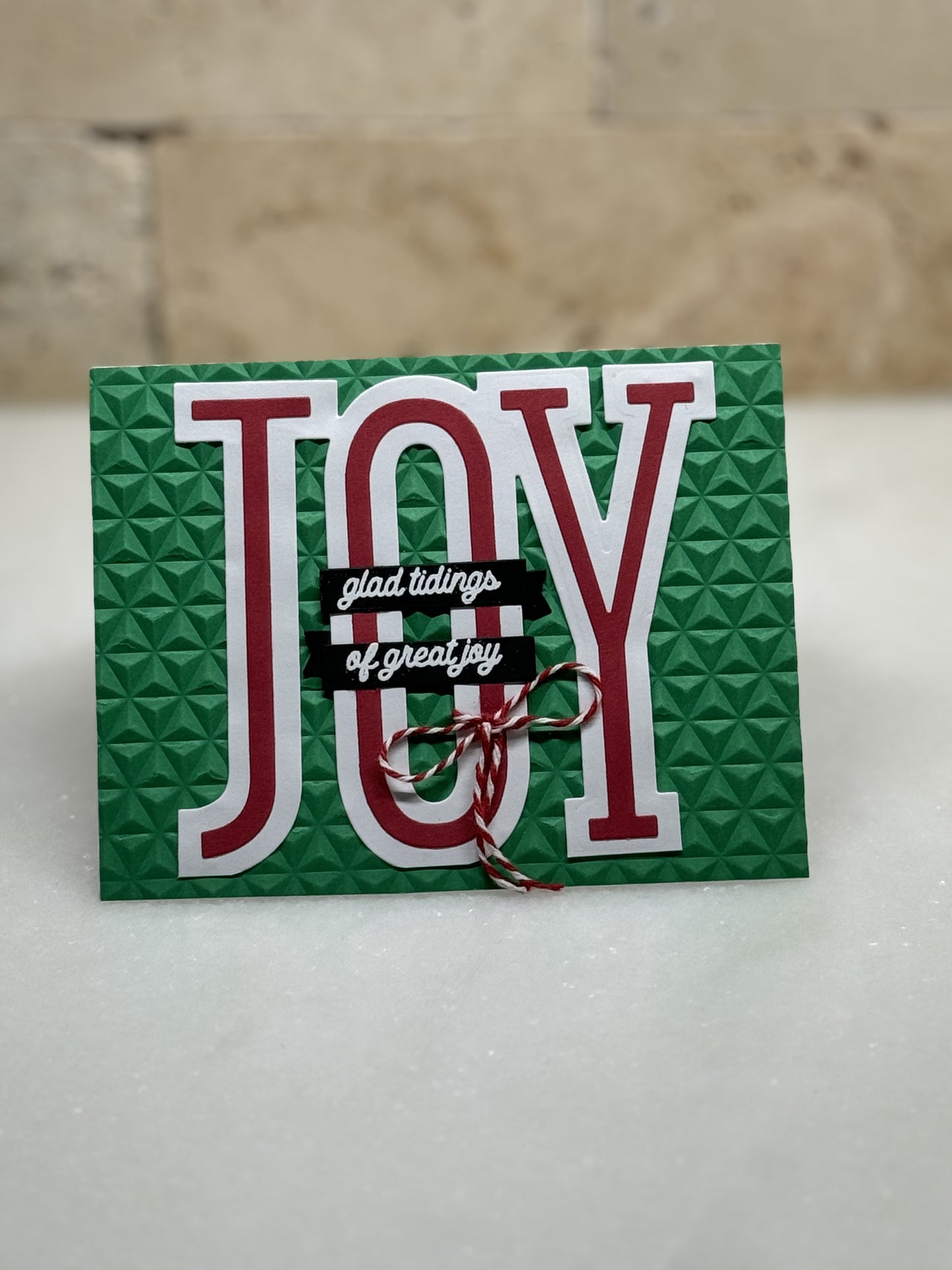 Joy glad tidings green/red